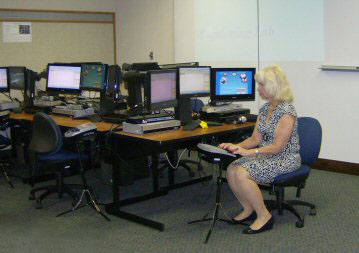 Dolores Oliveira Gonzalez practicing on a computer for court reporting in a computer lab
