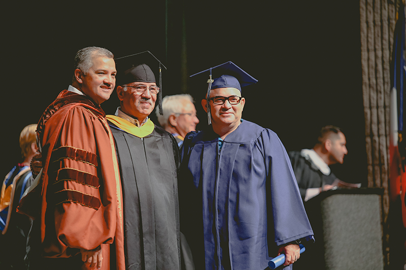 President and CEO Mark Escamilla, Ph.D. alongside Domingo Vela, Professor of welding and Del Mar College graduate Samuel Garcia