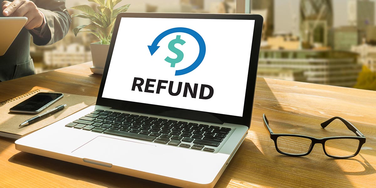 Laptop computer with REFUND on the screen