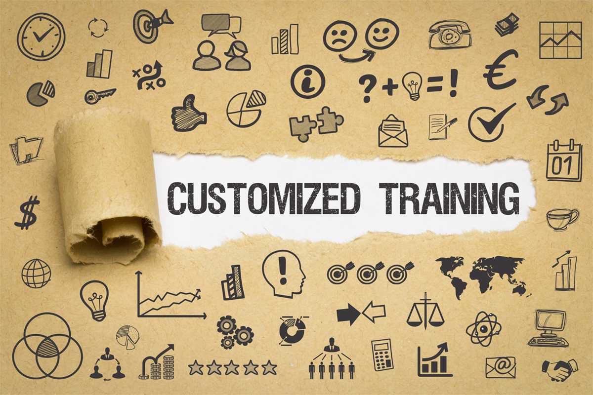 Brown packaging paper with doodles is ripped, showing the words Customized Training