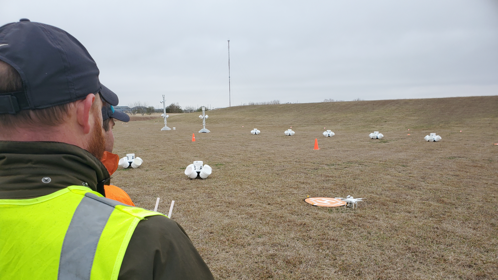 GIS students flying a drone in an obstacle course.