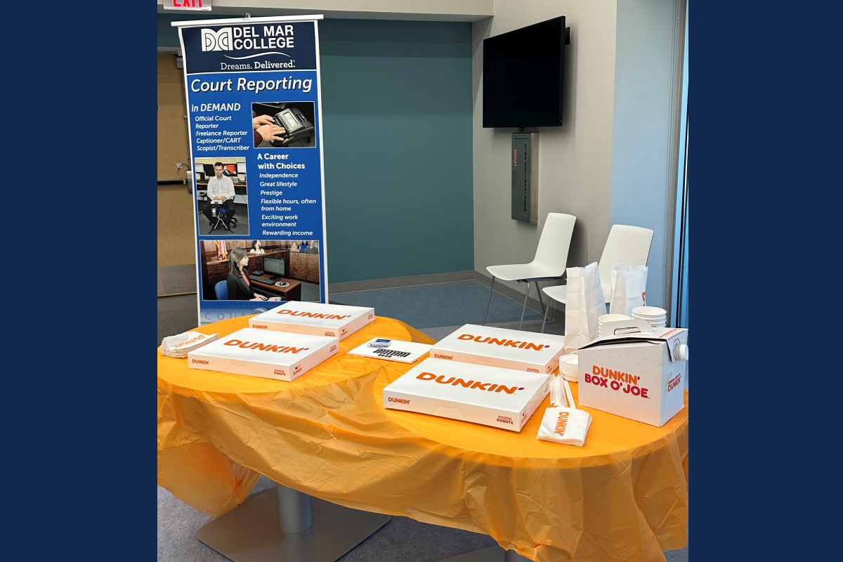 Welcome table for Project Steno students with donuts from Dunkin Donuts