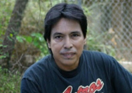 Photo of Tony Alcazar posing outside