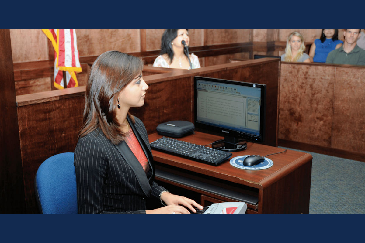 A court reporter transcribes a court case in a courtroom