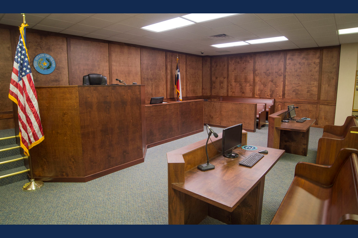 A picture of a courtroom with a US flag