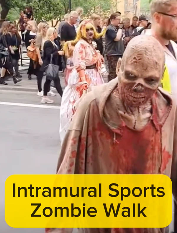 People in zombie costumes walking on a street