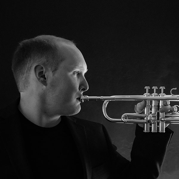 Brent playing a trumpet