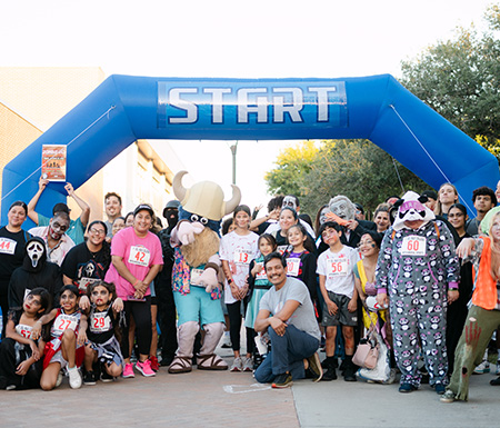People posing at the race start line