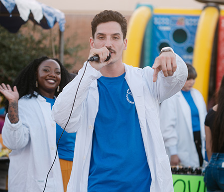Person with a microphone at Viking Fest